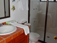 Ensuite Master Bathroom of 2-bedroom condo, all tile, easy walk-in shower